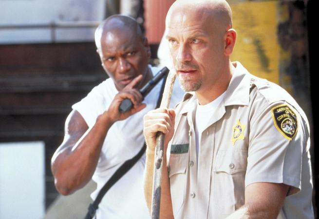 CON AIR, from left: Ving Rhames, John Malkovich, 1997. ©Buena Vista Pictures