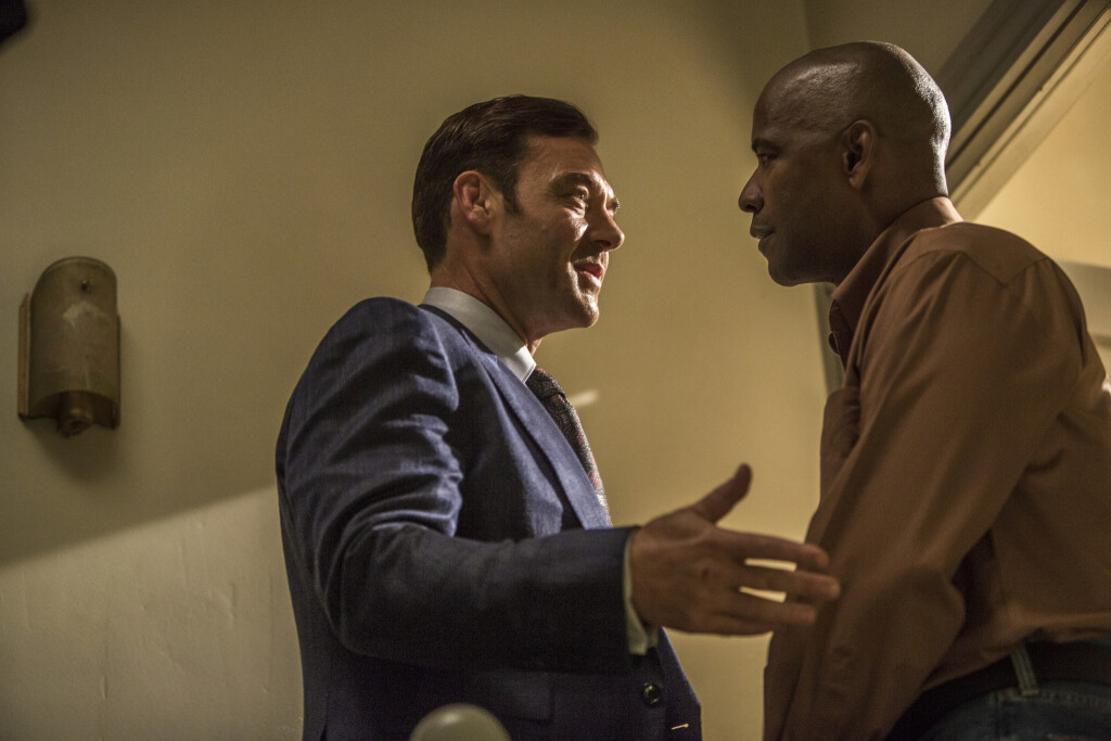 Teddy (MARTON CSOKAS, left) meets McCall (DENZEL WASHINGTON) at his apartment in Columbia Pictures' THE EQUALIZER.