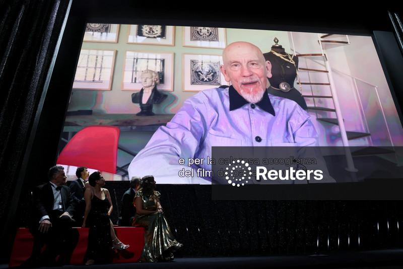 The Jury of the 83rd Venice International Film Festival look at a video message from John Malkovich, winner of the Coppa Volpi Award for Best Actor during the closing ceremony of the 83rd Venice International Film Festival, Italy, September 12, 2026. REUTERS/Yara Nardi